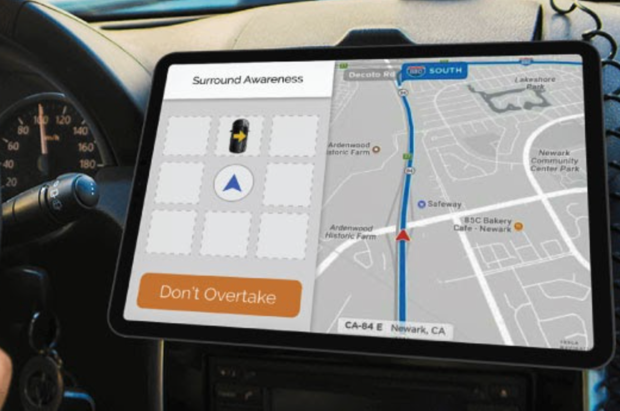 The in-car navigation concept, showing surrounding cars and a "Don't Overtake" warning.